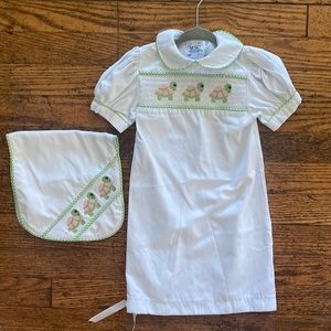 Smocked white infant gown with matching burp cloth